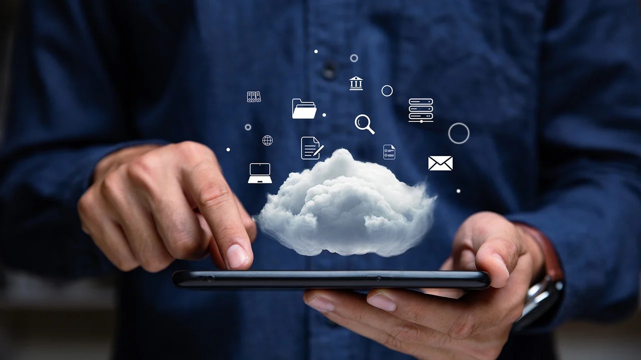 A Man Holding A Cloud Software Concept